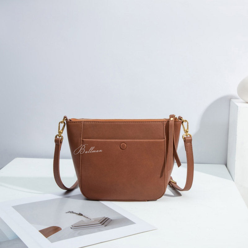 Ballman H98075 women crossbody bag made of full-grain genuine leather, front snap pocket, zipper top, adjustable strap minimalist bucket style handbag