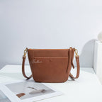 Ballman H98075 women crossbody bag made of full-grain genuine leather, front snap pocket, zipper top, adjustable strap minimalist bucket style handbag