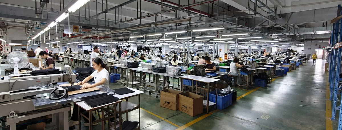 Leather bag factory workshop interior, mass production assembly line with workers
